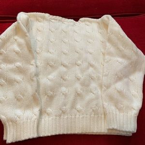 White infant sweater with pink polo logo